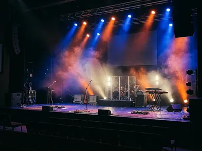 String lights over couches in the youth room